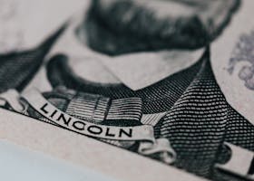 Detailed close-up of Abraham Lincoln's portrait on currency showcasing intricate engraving.