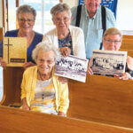 100-year-old Pauline Anderson is seated as she recalls fond memories at the West Fork Baptist Church where she looks forward to many more. Pictured from left are Margie Sparks, Pauline’s daughter, who still attends at West Fork, Ila Tankersley, Harry and Bernadette Holman, who are all members there. They got together to share information and photos of days gone by and hope to see everyone at the upcoming 200-year celebration on June 28 at the church.